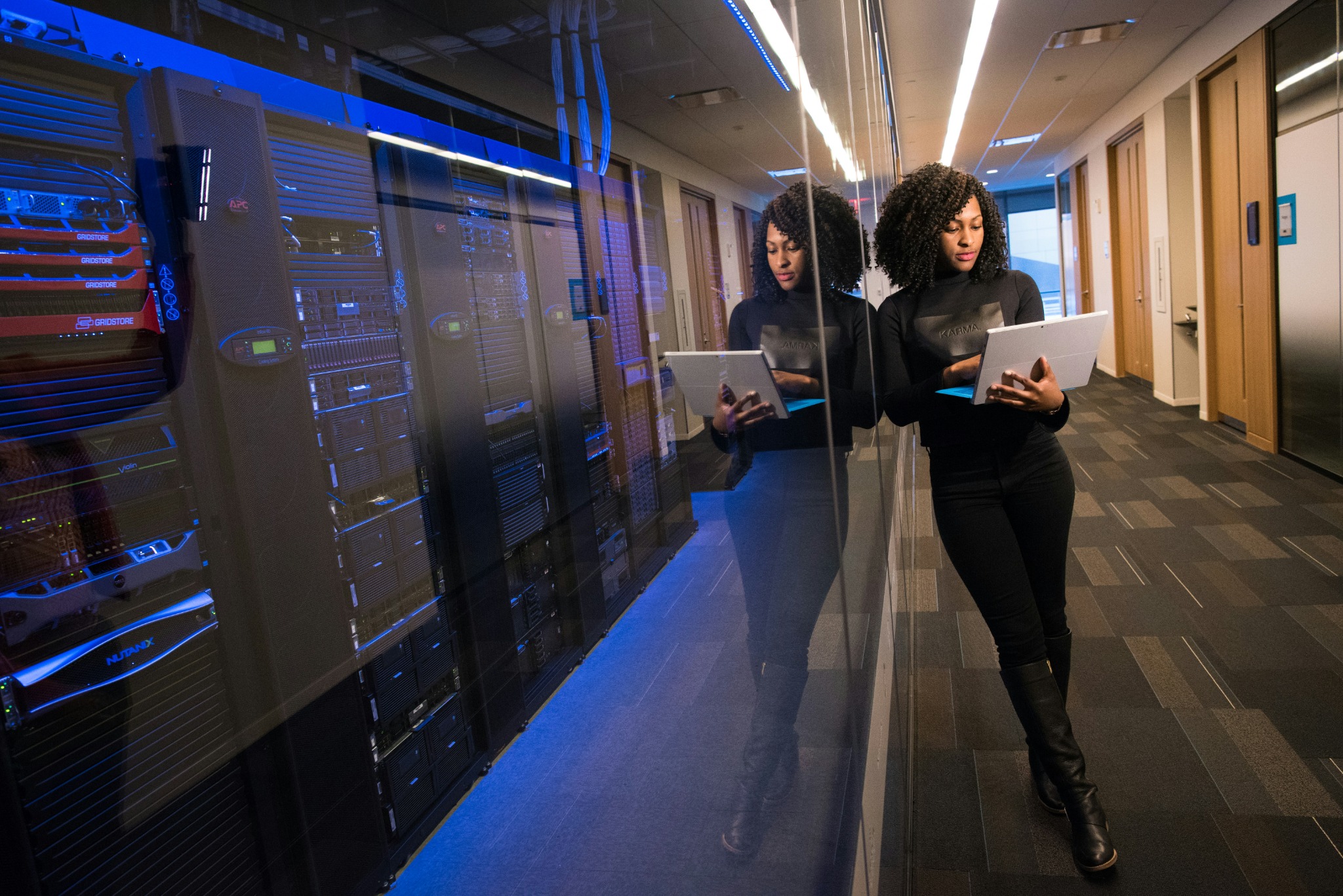 IT professional working near server racks